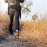 Oung Man Traveler with backpack relaxing outdoor.