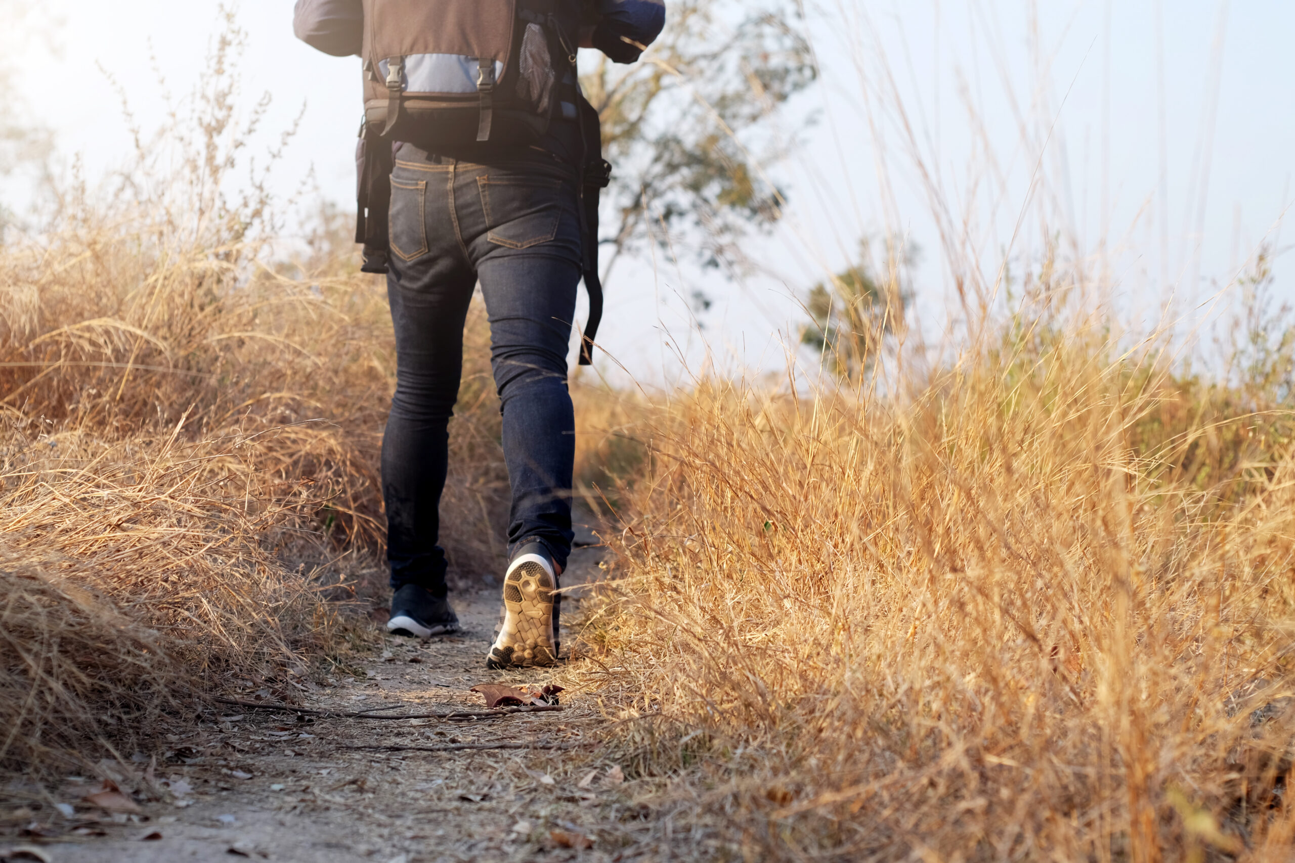 Oung Man Traveler with backpack relaxing outdoor.